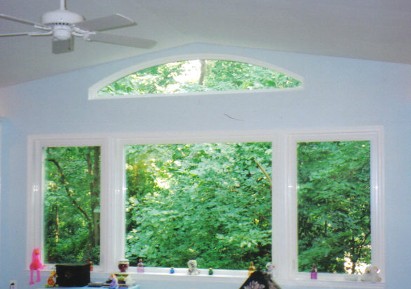 picture window with arched eyebrow window