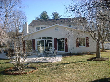 addition with oversized Andersen windows and eyebrow window